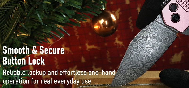 Knife with pink handle and damascus blade on a wooden surface, Christmas tree in the background