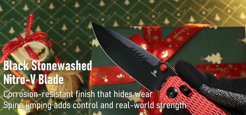 Knife with black stonewashed Nitro-V blade against a festive background with presents and a teddy bear.